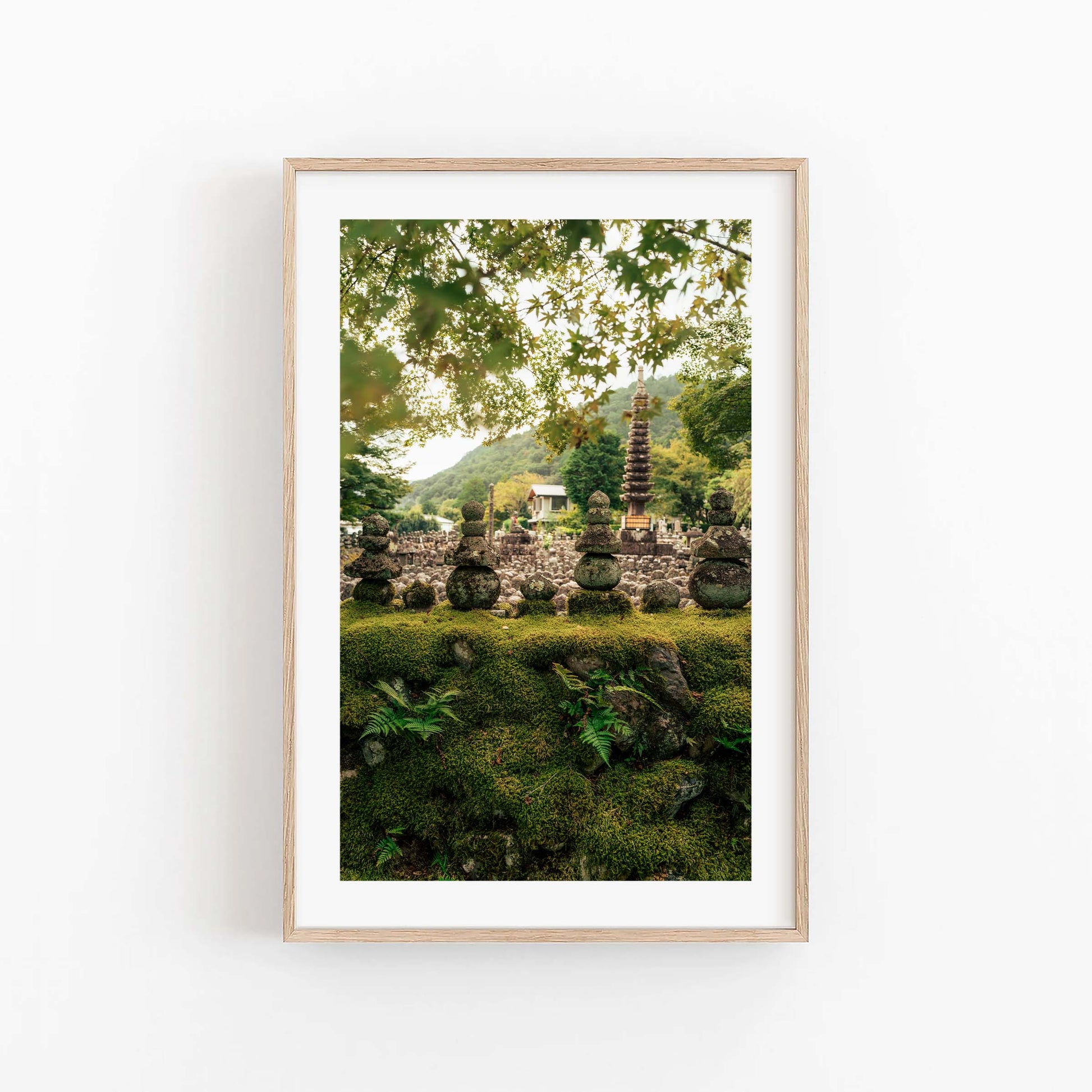 Framed photo titled Adashino Nenbutsu-ji with a serene garden, stone pagoda, lush greenery, and mountain backdrop.