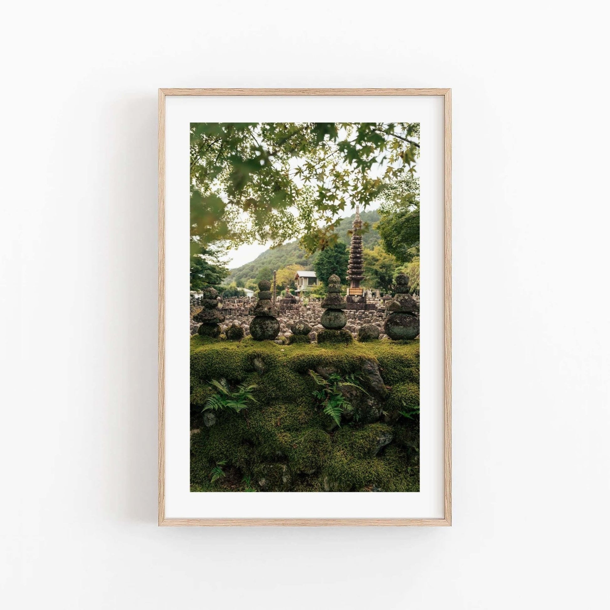 Framed photo titled Adashino Nenbutsu-ji featuring a serene Japanese garden with stone pagodas and lush greenery.