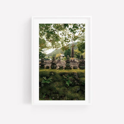 Framed photo titled Adashino Nenbutsu-ji features a serene garden with a stone pagoda, lush greenery, and a mountain backdrop.