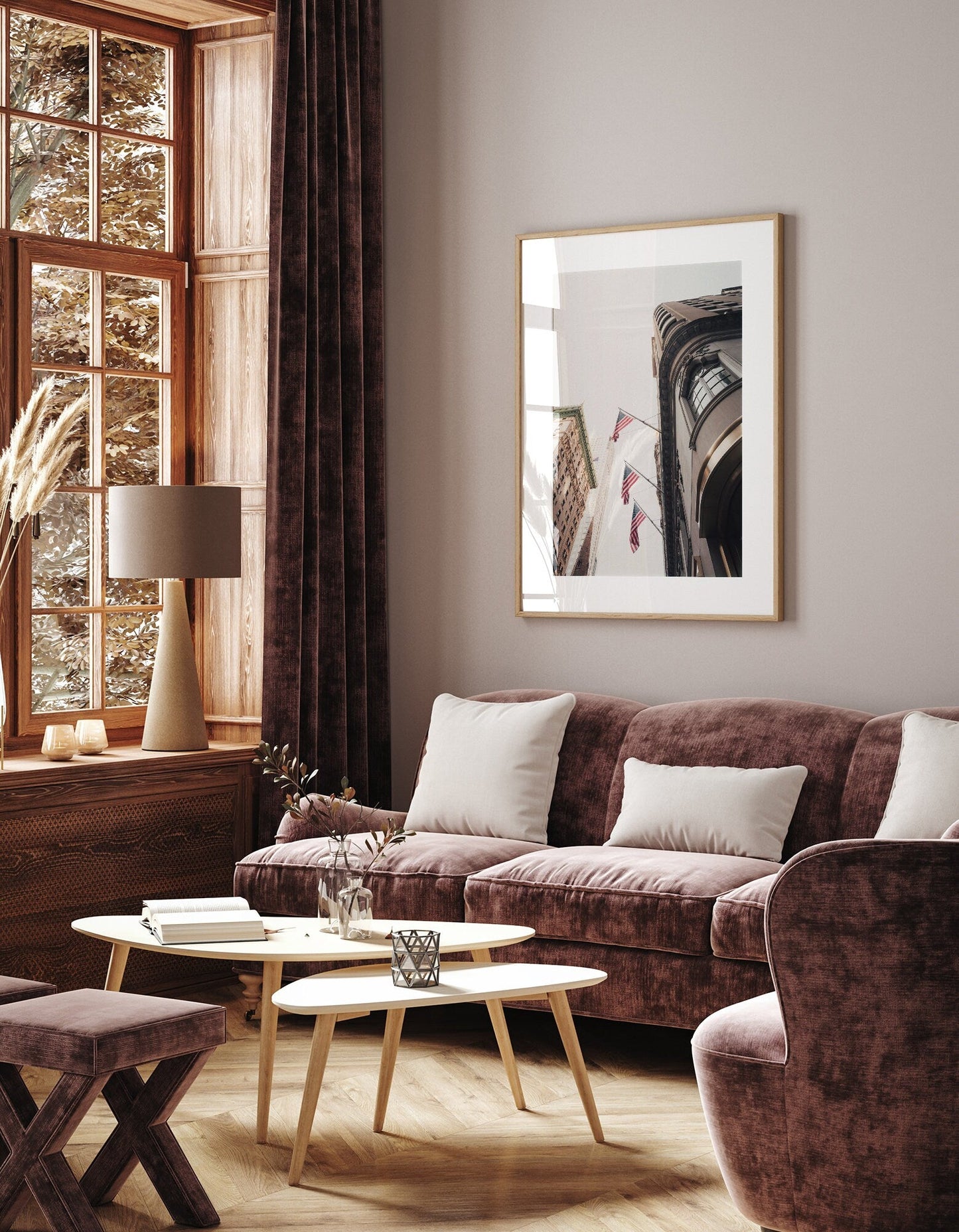 Cozy living room with plush American Pride sofa, armchair, wooden tables, large window, and framed artwork on wall.