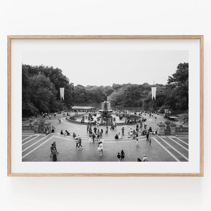 Black and white photo of people at Bethesda Fountain in Central Park, surrounded by trees. Product: Bethesda Fountain B&W.