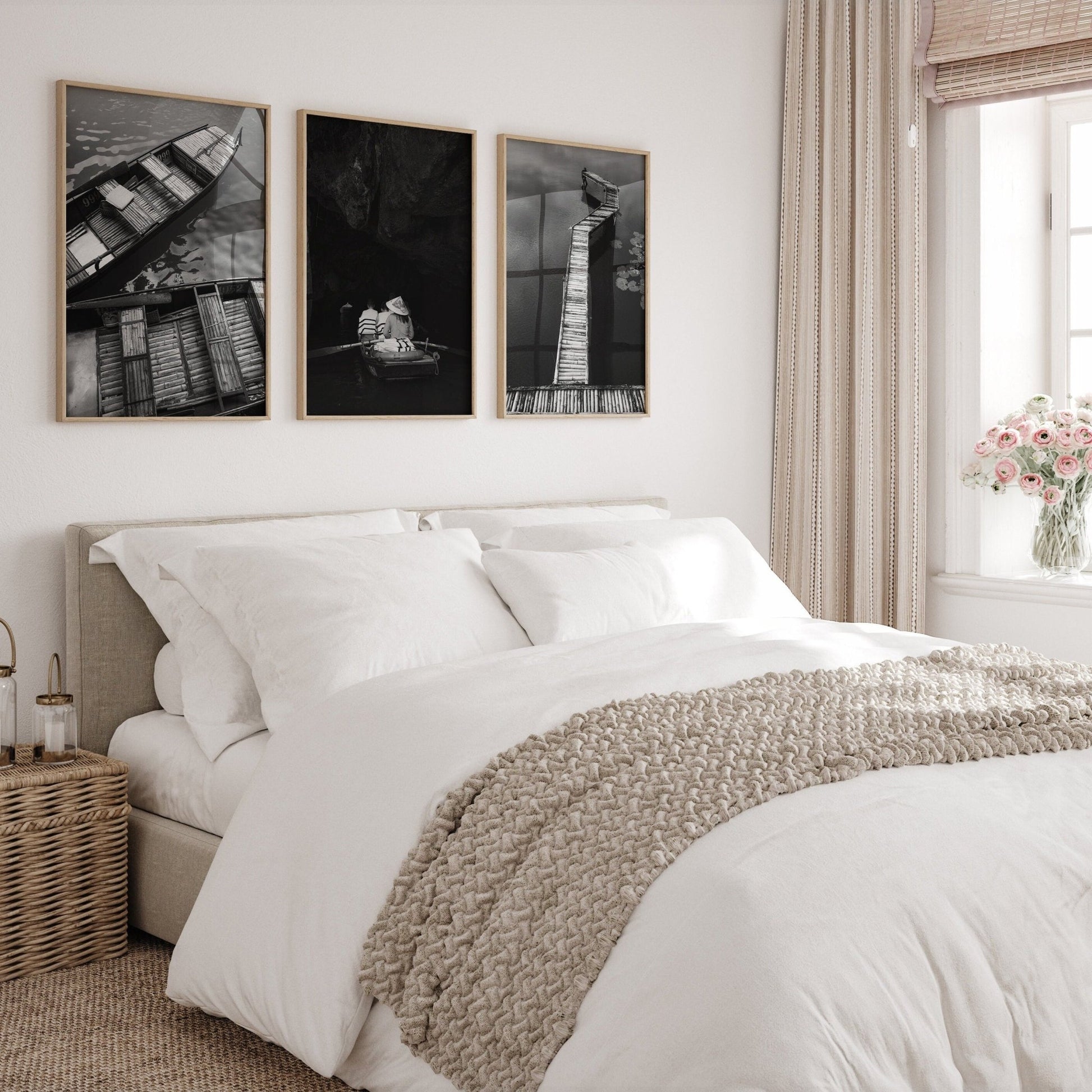 Cozy bedroom with white bedding, a wicker basket, and Black and White Vietnam Bamboo wall art set of 3.