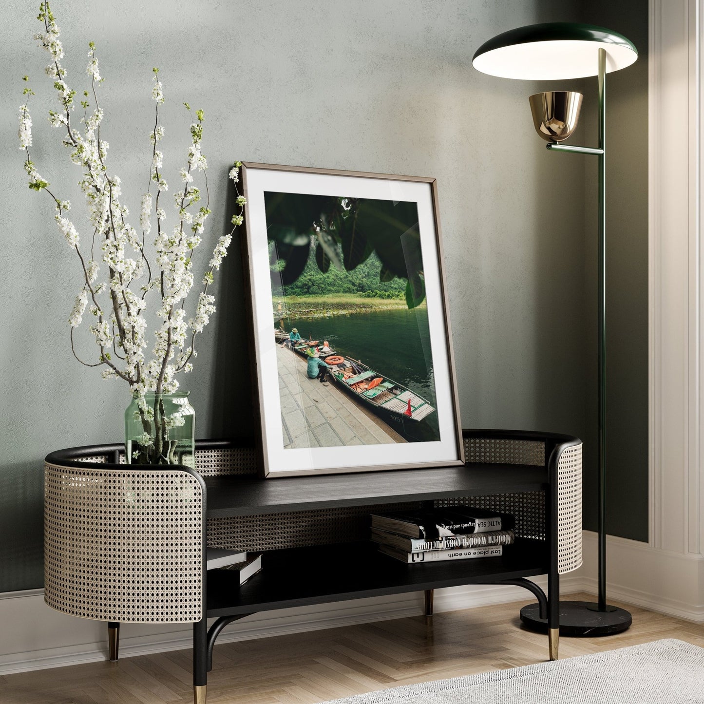 Cozy room with the Break Time framed art on a console, a floor lamp, and a vase of white flowers.