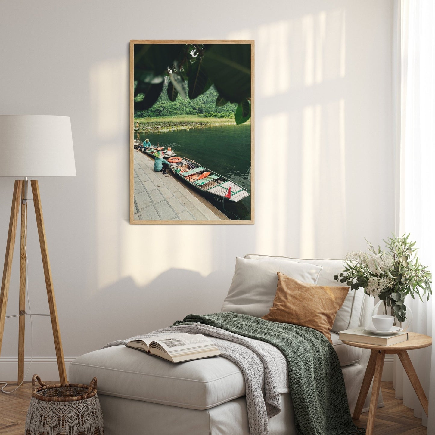 Cozy room featuring the Break Time floor lamp, couch, nature photo on wall; soft light casts shadows on a light-colored rug.