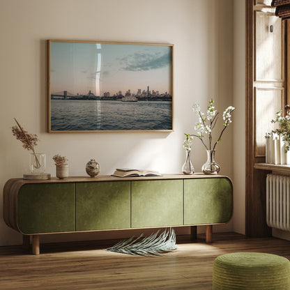 Modern living room with green sideboard, decorative vases, and a large Brooklyn Sunset photo on the wall.