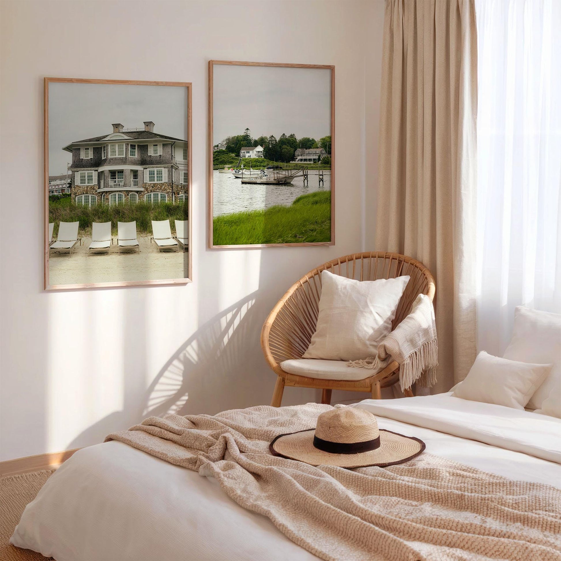 Cozy bedroom with neutral tones, a wicker chair, and Cape Cod - Set of 2 framed seaside photos above the sunlit bed.