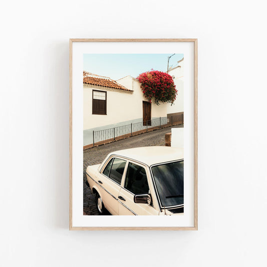 Classic in Bloom framed photo: vintage cream car parked by a house with pink bougainvillea flowers.
