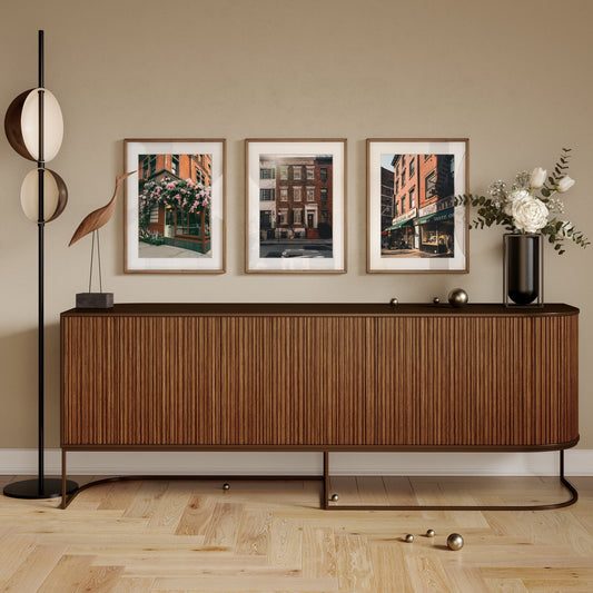 Modern sideboard with decor and the Classic New York - Set of 3 framed cityscape photos on the wall.