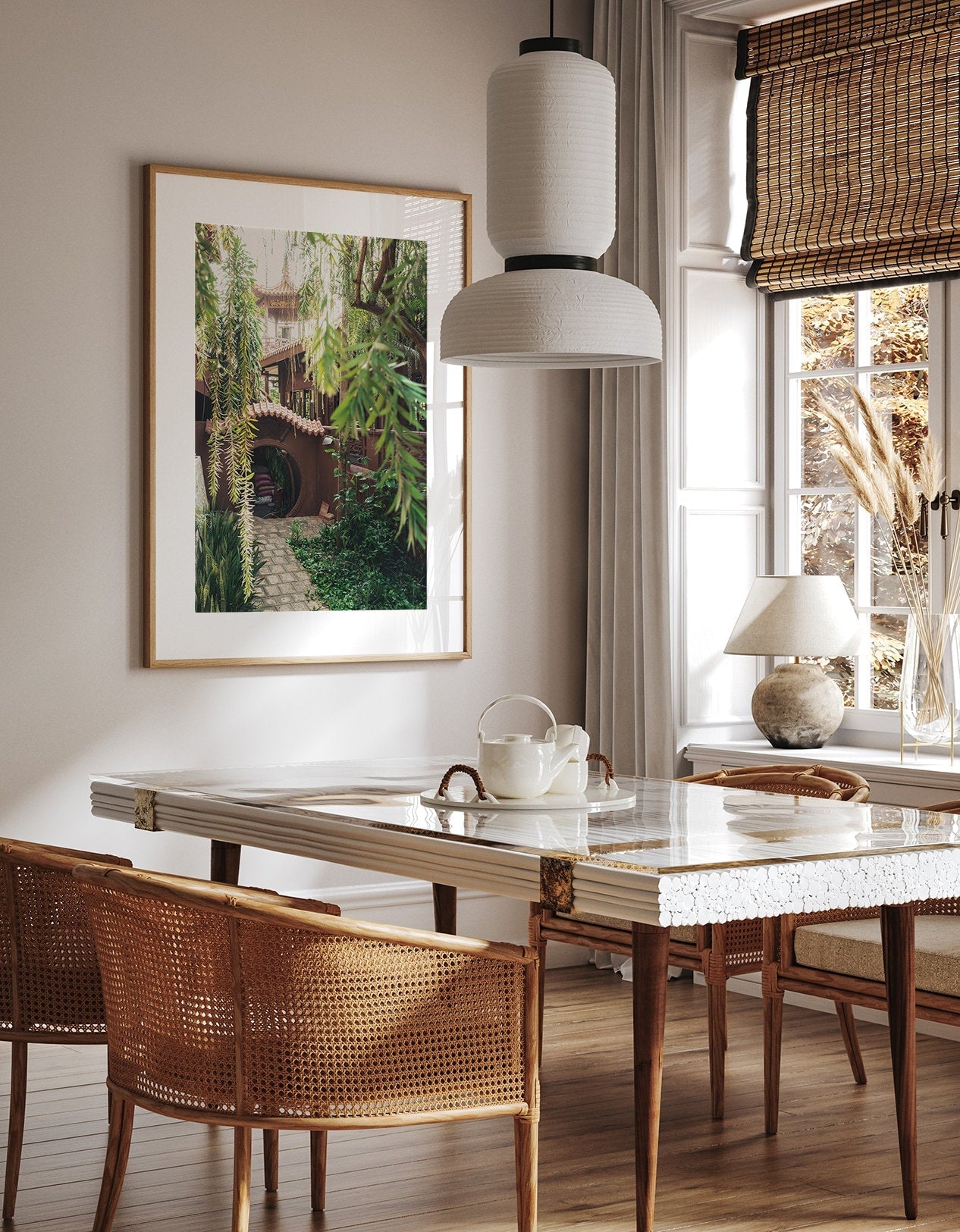 A cozy dining room with Earthy Enlightenment décor: a marble table, wicker chairs, and a garden-view window.