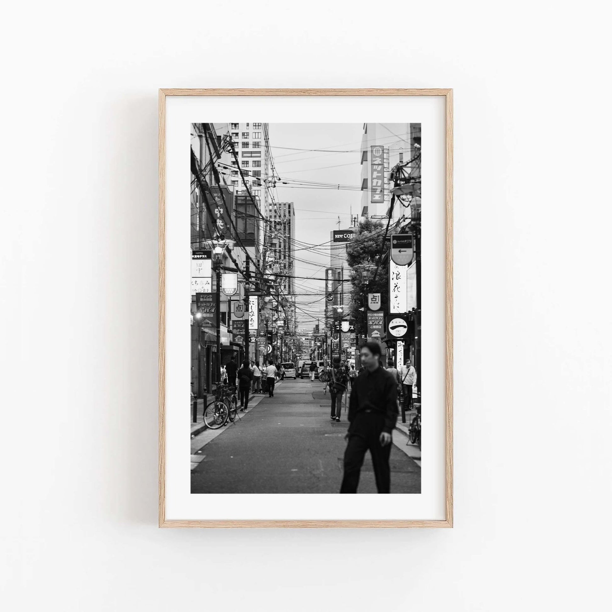 Echoes of Osaka black-and-white Japanese print in a natural wood frame.