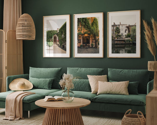 Stylish living room with green sofa, wood table, neutral decor, and European Charm - Set of 3 on a dark green wall.