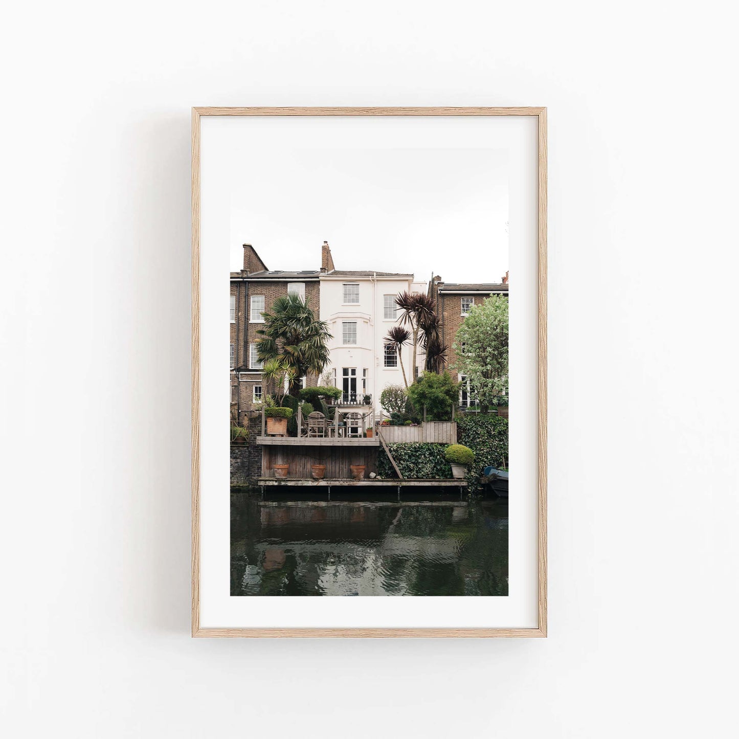 Set of 3 framed photos: European Charm features riverside houses with gardens, palm trees, and scenic decks.