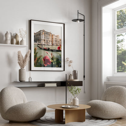Modern living room featuring the Floral Passion wall art, round chairs, a circular table, and neutral minimalist decor.