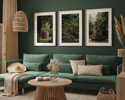 The Green Peace room features a velvet sofa, wooden table, wall art, and cozy decor elements.