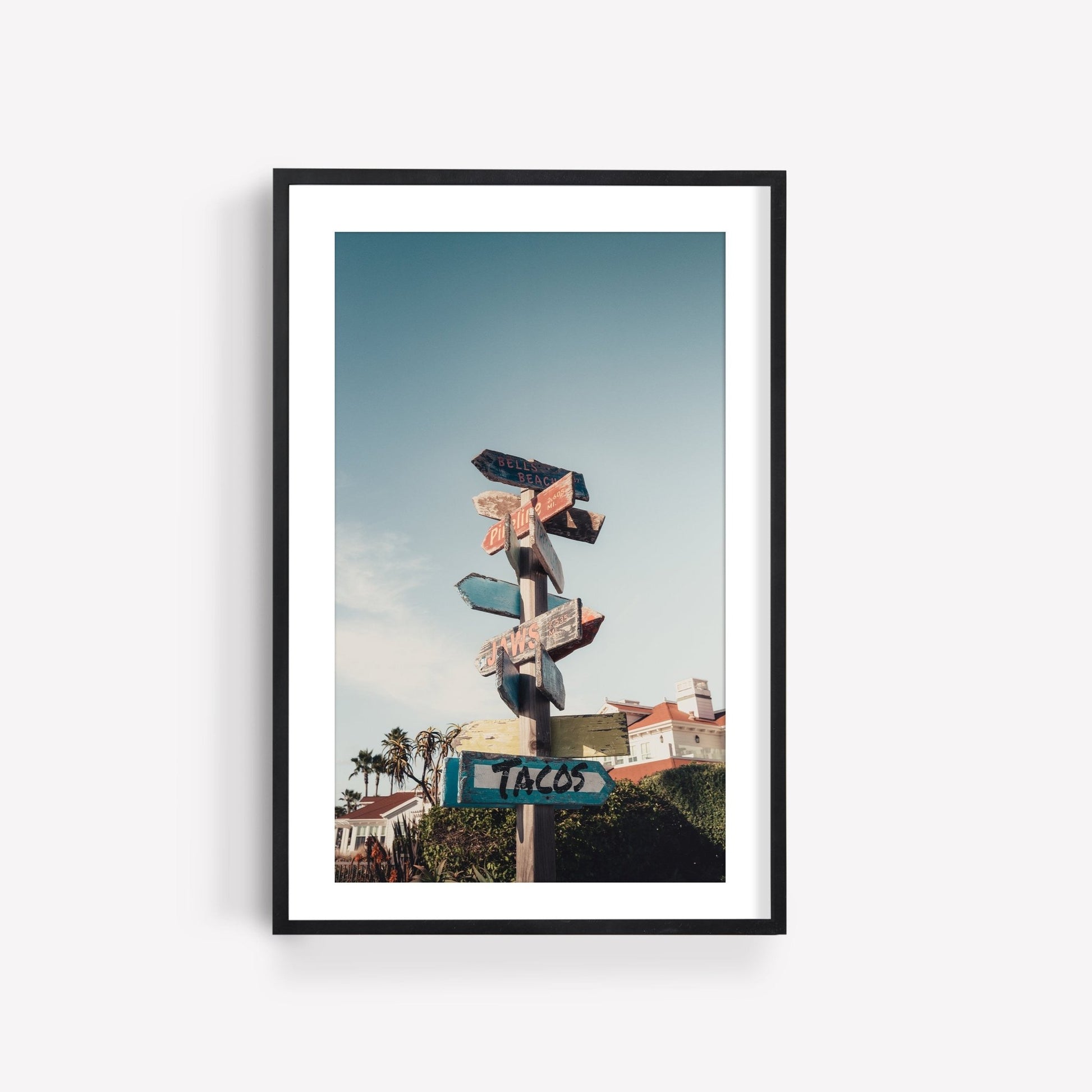 Framed image titled Guide the Way of a multi-directional signpost with colorful arrows under a clear sky.