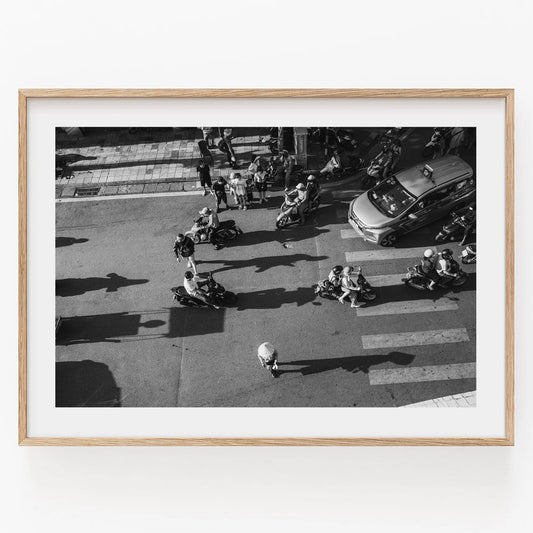 Aerial view of Hanoi Street Crossing in black and white, framed in a simple wooden frame.