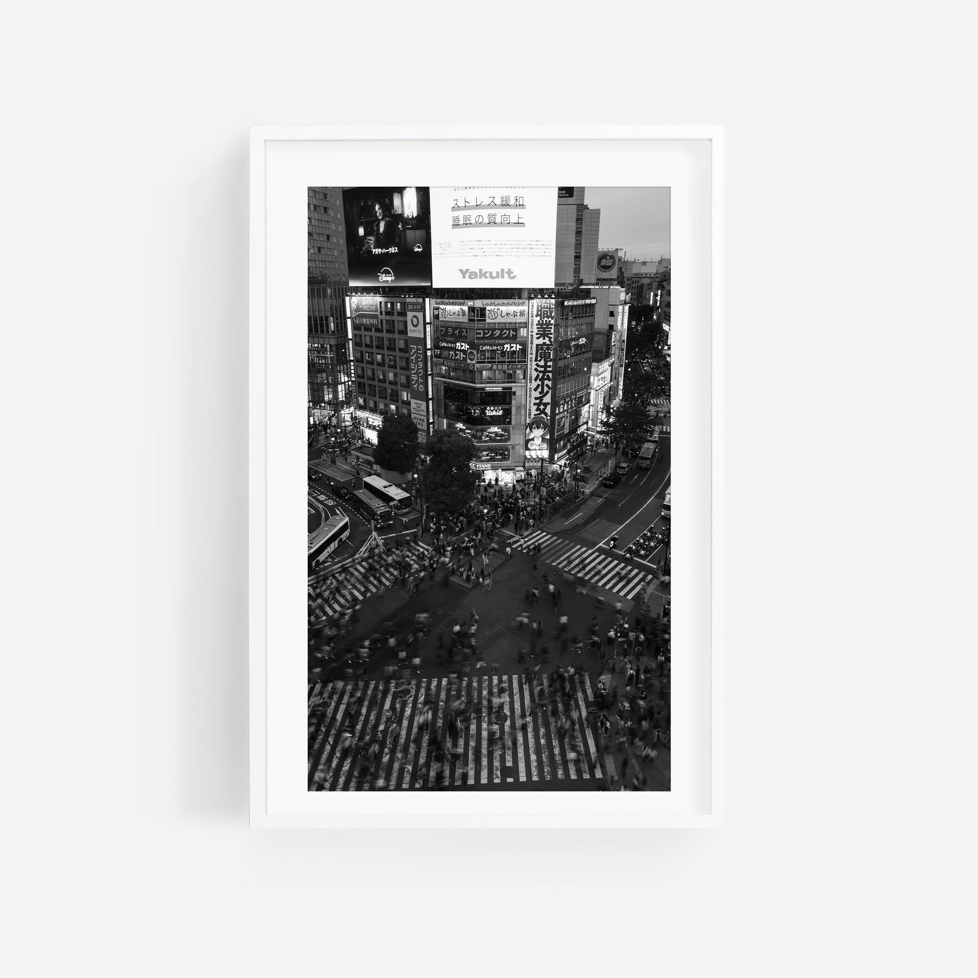 Japanese Cities Black and White - Set of 3: Bustling city intersection with people crossing and illuminated billboards.