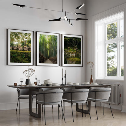 Minimalist dining room with modern table, gray chairs, and Japanese Lush art. Large window fills space with natural light.