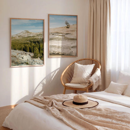 Cozy bedroom with neutral tones, wicker chair, sunlight, and Sierra Stillness - Set of 2 landscape art prints.