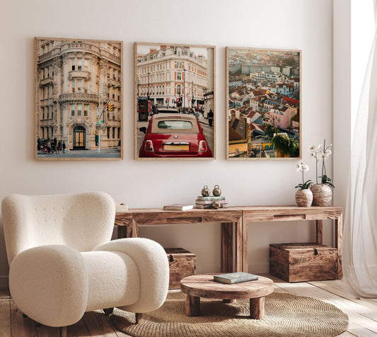 Cozy living room with a white armchair, wooden furniture, and The Atlantic Trio - Set of 3 on the wall.