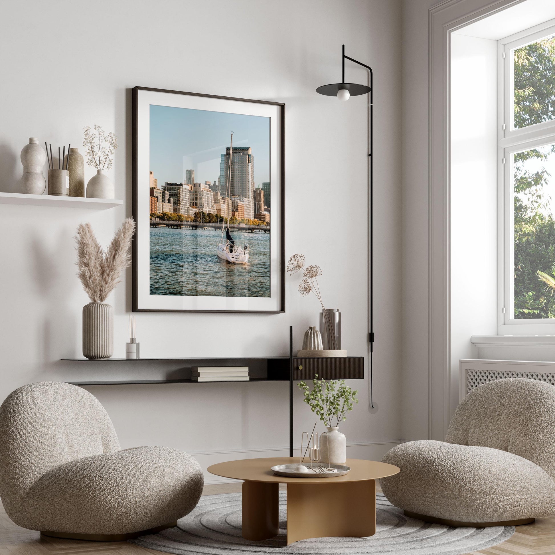 Modern living room with Tribeca Waters, two round chairs, a circular coffee table, and neutral decor by the window.