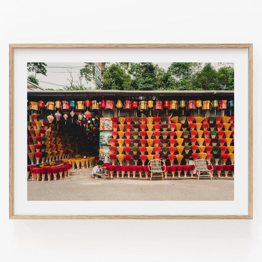 The Incense Shop features a vibrant incense display with two chairs, framed by lush greenery.