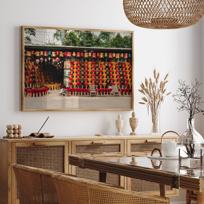 Dining room with Incense Shop wicker furniture and a colorful wall tapestry.