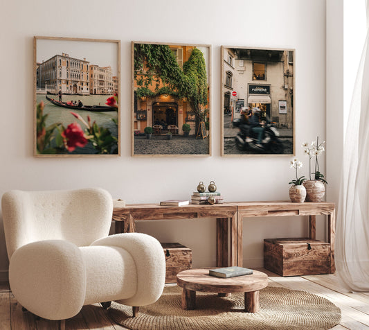 Cozy living room with wooden furniture, a white plush chair, and the Italy - Set of 3 cityscape photos on the wall.