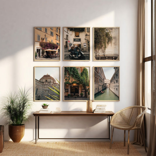 The Italy - Set of 6 framed photos of European street scenes adorn a gallery wall above a console table in a sunlit room.