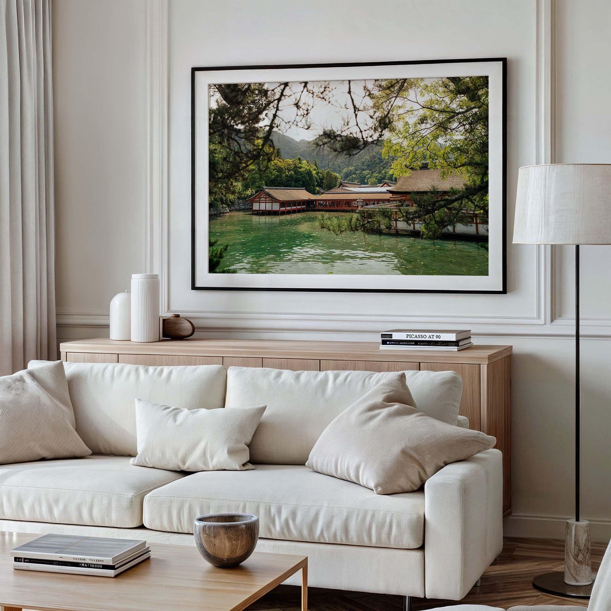 Living room with a white sofa, the framed picture Itsukushima Shrine I, and neutral decor accents.