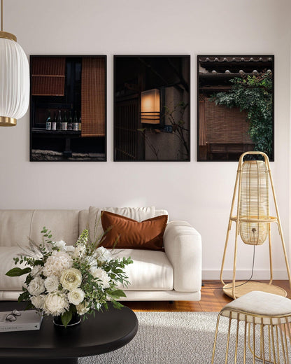 Cozy living room with a white sofa, floral arrangement, and Japanese Serenity - Set of 3 framed pictures on the wall.