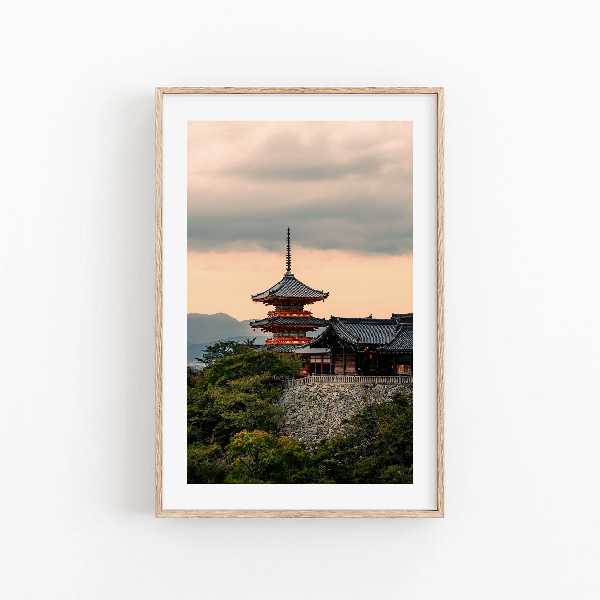 Framed photo titled "Kiyomizu-dera Sunset I" shows a Japanese pagoda among trees at sunset with a cloudy sky.