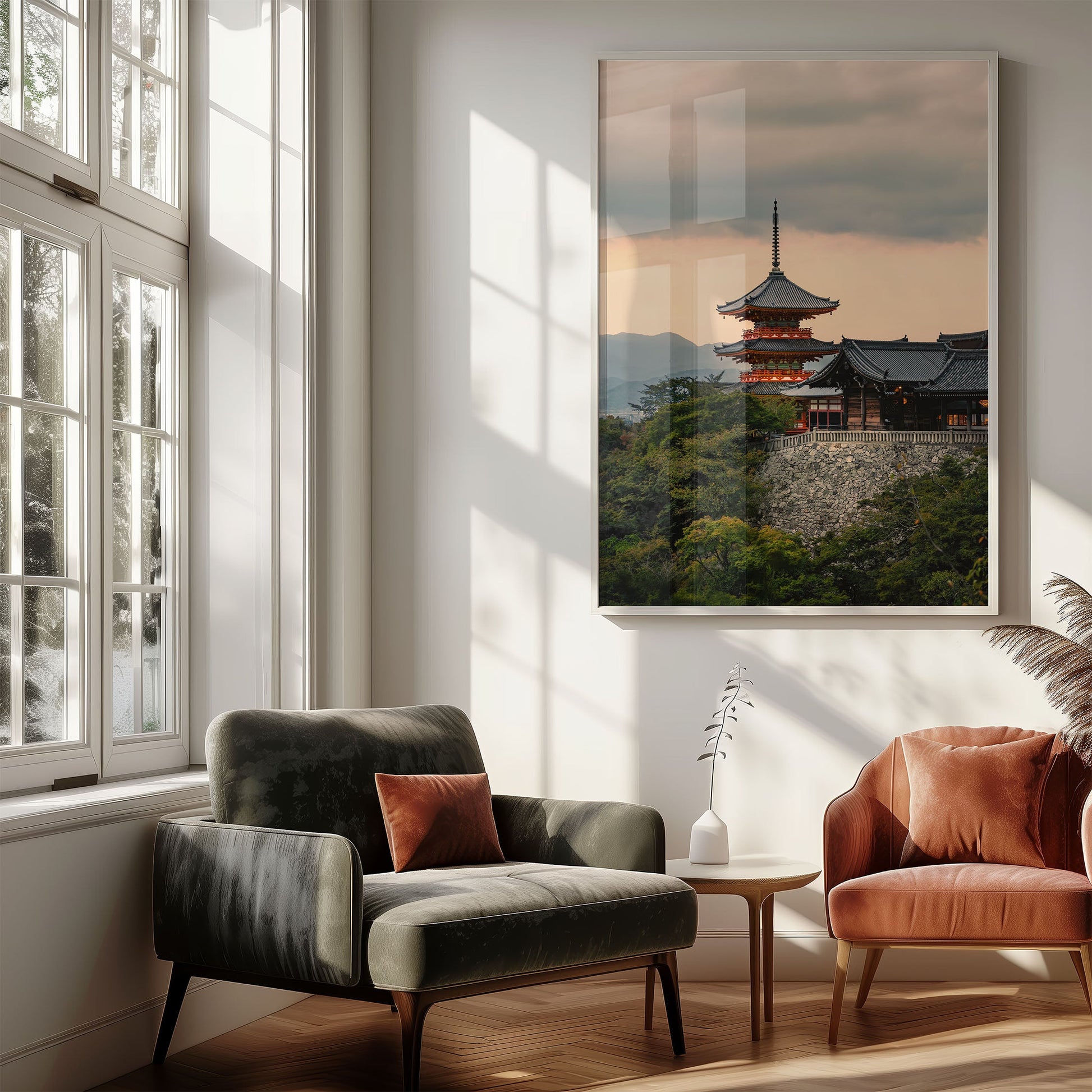 A cozy living room with modern chairs, side table, and the Kiyomizu-dera Sunset I photo framed on the wall.