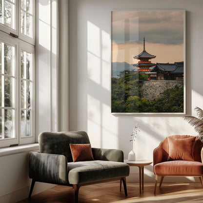 A cozy living room with modern chairs, side table, and the Kiyomizu-dera Sunset I photo framed on the wall.