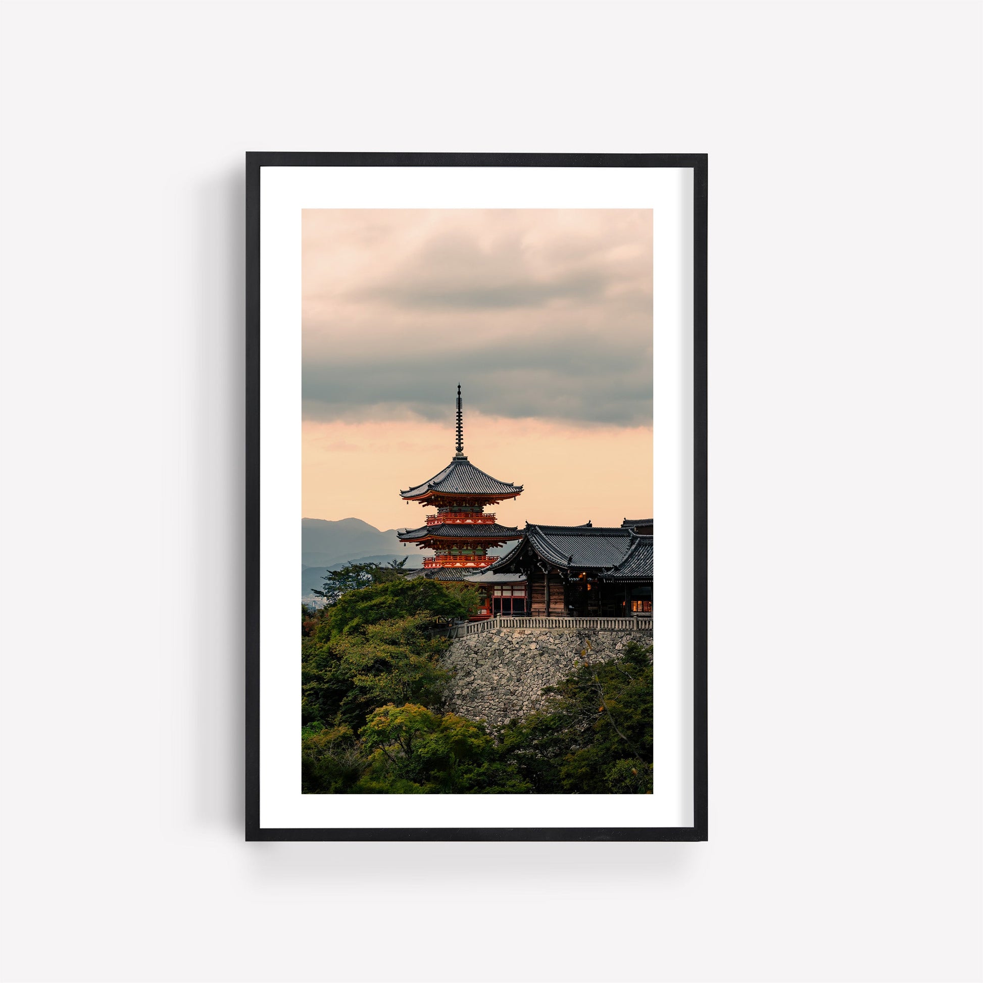 Framed photo "Kiyomizu-dera Sunset I": a Japanese pagoda amid trees beneath a cloudy sunset sky.