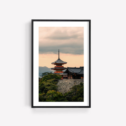 Framed photo "Kiyomizu-dera Sunset I": a Japanese pagoda amid trees beneath a cloudy sunset sky.