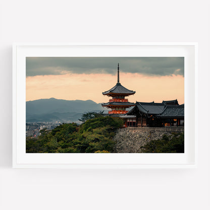 Kiyomizu-dera Sunset II: A Japanese pagoda atop a hill at sunset, with mountains and city in the background.
