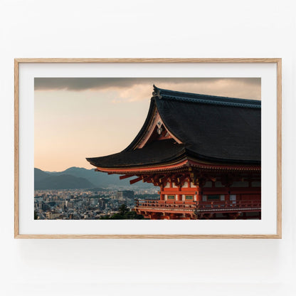 A framed photo titled Kiyomizu-dera Sunset III showcases a traditional Japanese temple set against a cityscape and mountains.