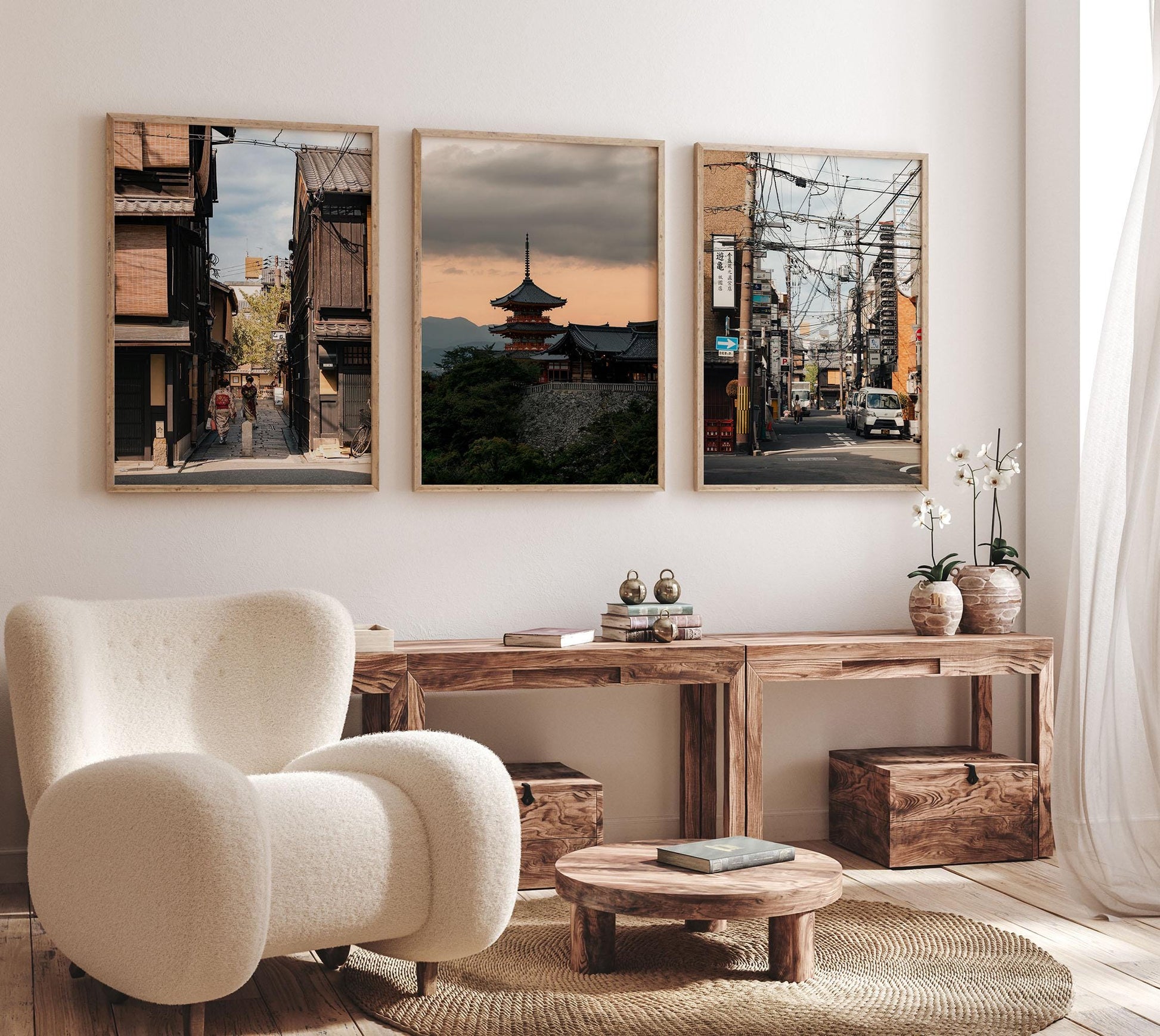 Modern living room featuring plush chair, wooden furniture, and Kyoto Allure - Set of 3 framed landscape photographs.