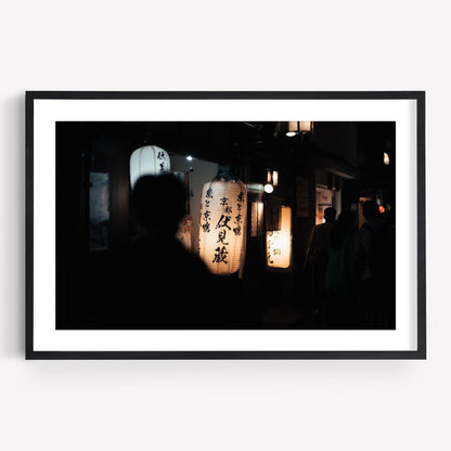 Kyoto At Night: Framed photo featuring a dimly lit street adorned with Japanese paper lanterns and silhouettes of people.