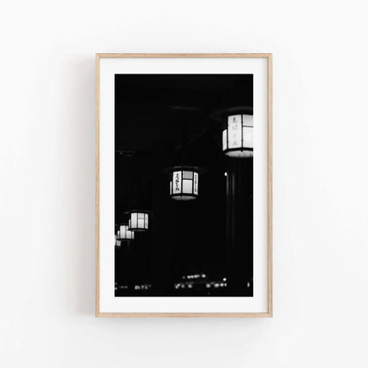 Black and white photo of hanging lanterns with Japanese characters displayed in a wooden frame, titled Kyoto Lanterns II - Black and White.