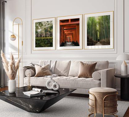 Sophisticated living room with a beige sofa, marble coffee table, and the Kyoto Set of 3 photography prints in gold frames.