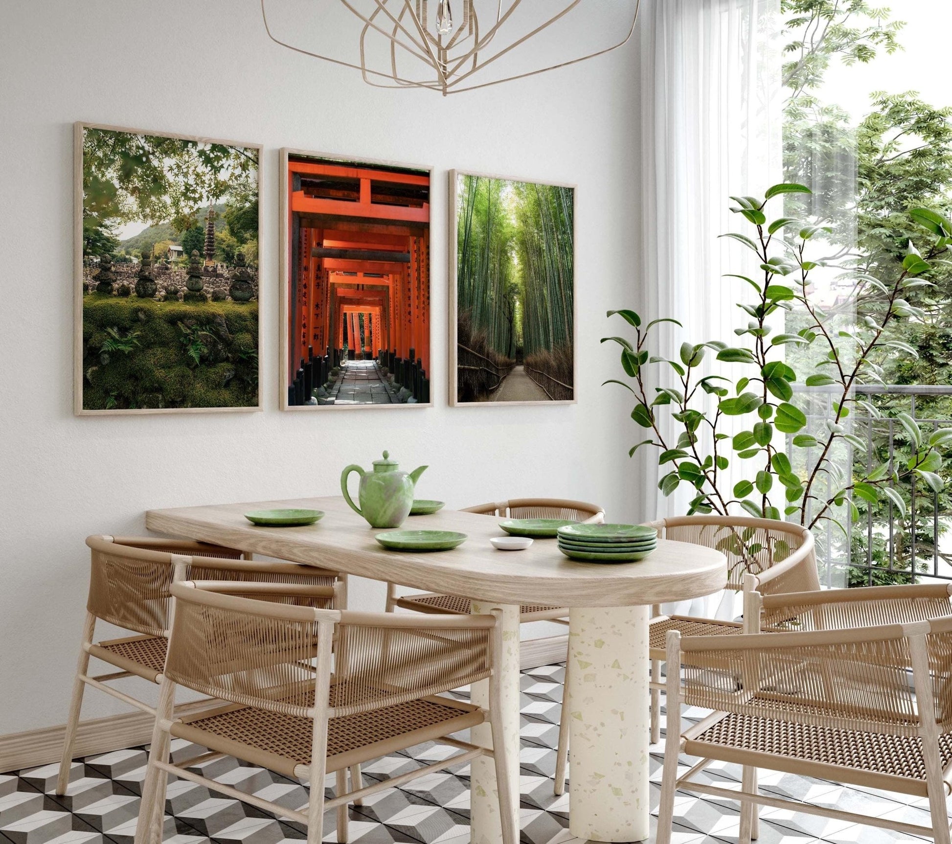 A bright and airy dining room features a wooden table, green teapot set, and zen wall art, enhanced by nature-themed decor. Kyoto Set of 3 photography prints near a large window and plants add tranquility to the space.