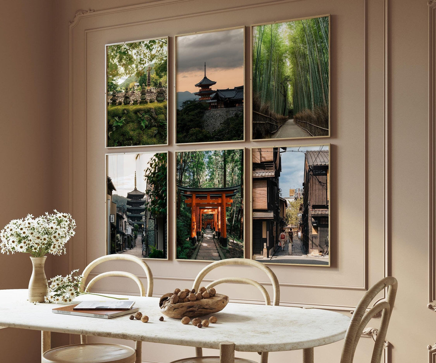 A dining room with a wooden table, chairs, and a wall adorned with six framed landscape photographs from the Kyoto set.