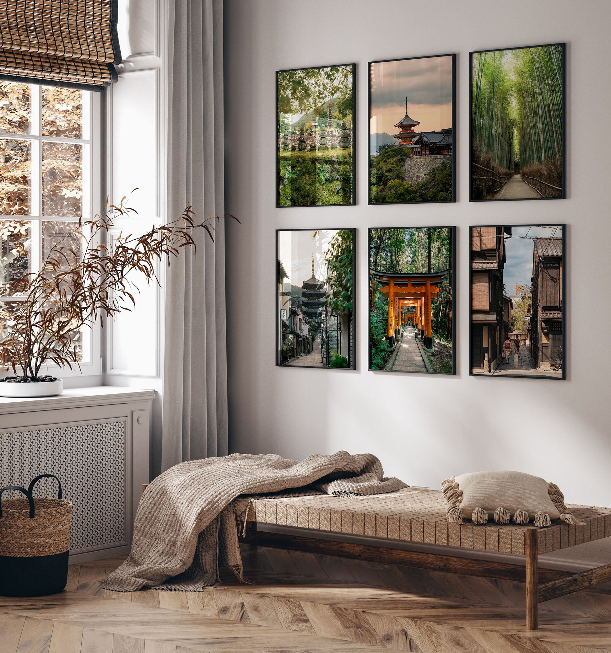 Minimalist room with a wooden daybed, cushions, and the Kyoto - Set of 6 framed nature and city photos above.