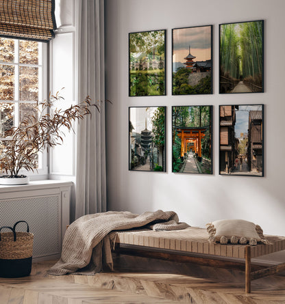 Minimalist room with a wooden daybed, cushions, and the Kyoto - Set of 6 framed nature and city photos above.