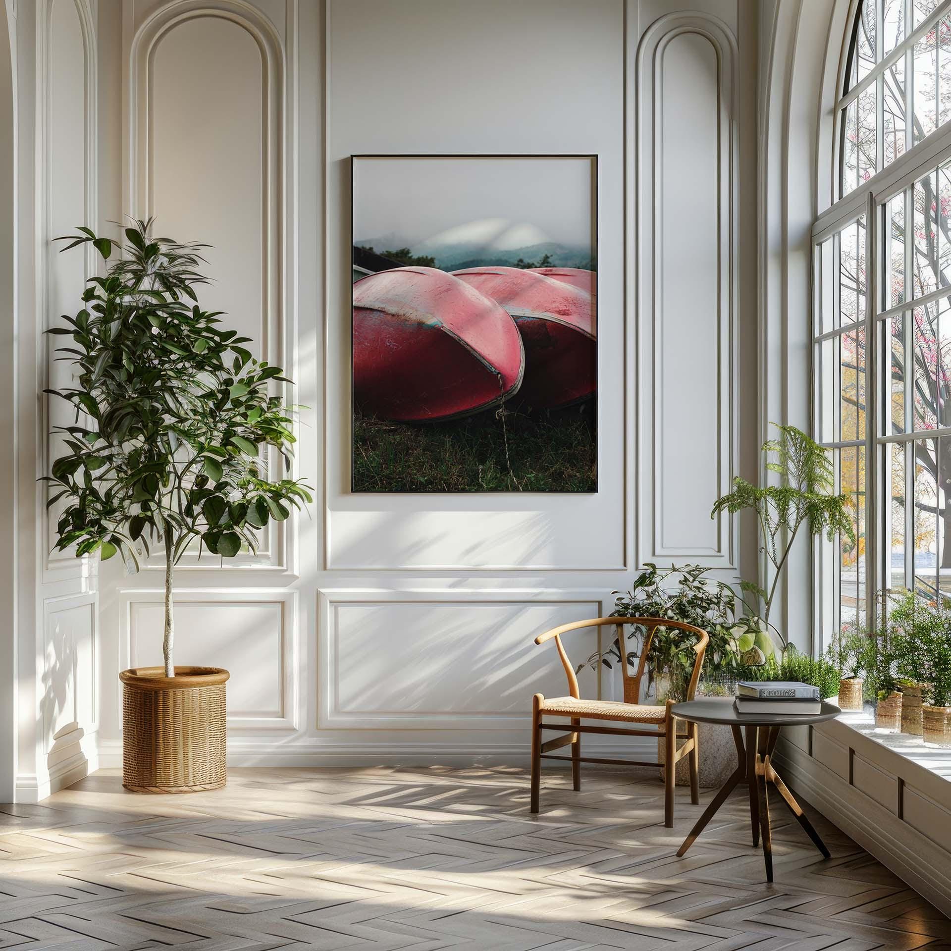 A bright room with large windows, a plant, a chair, and a framed painting of Lake Kawaguchi Boats on the wall.