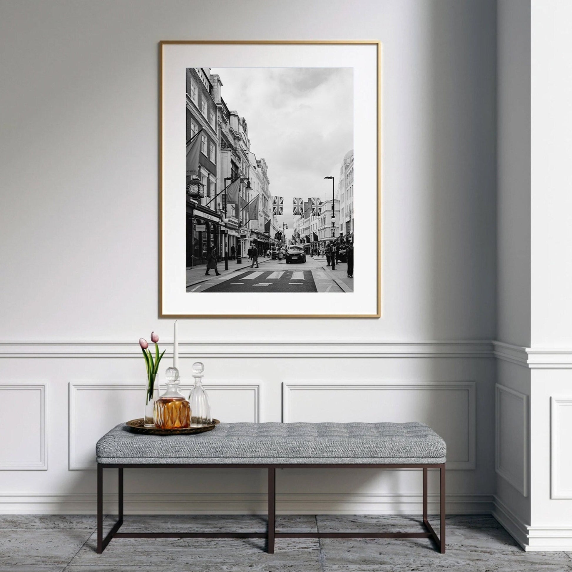 Elegant hallway with a bench and the Mayfair Black and White photo of a bustling street on the wall.