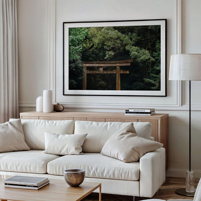 Modern living room with beige sofa, neutral decor, and a Meiji Jingu Shrine photo framed on the wall.