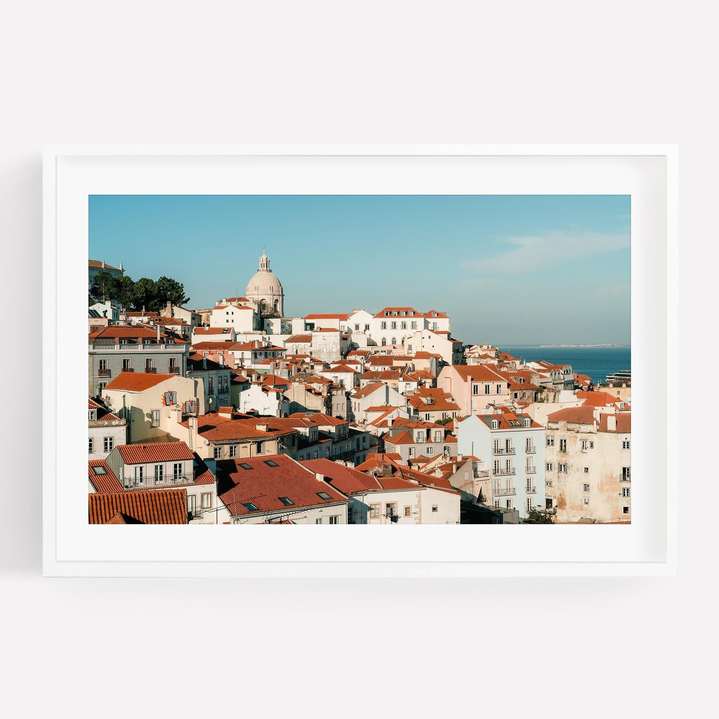 Framed photo Miradouro of a coastal town with red rooftops, white buildings, and a domed church.